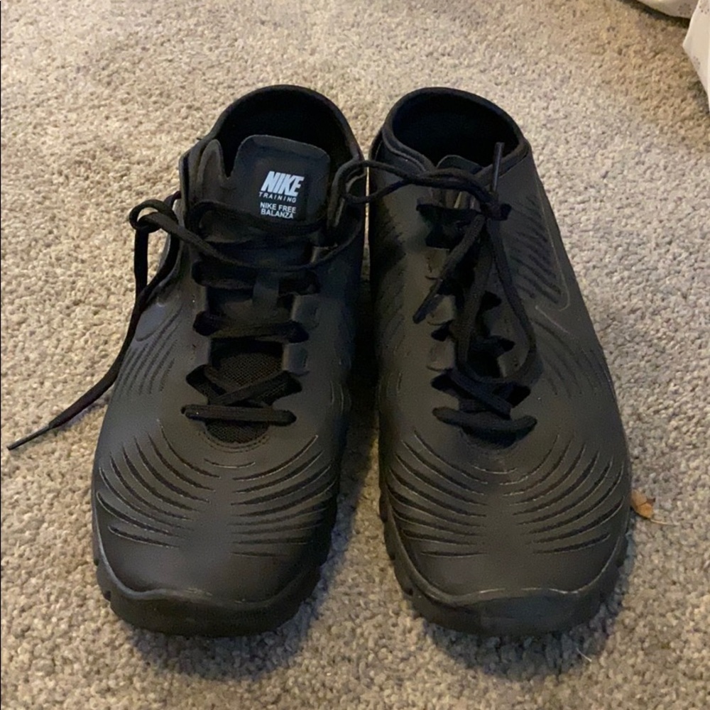All black Nike running shoes